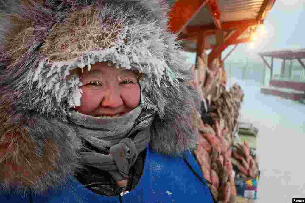 Vendor Nyurgusun Starostina, 47, poses for a picture at an open-air market on a frosty day in Yakutsk, Russia.&nbsp;Temperatures in parts of the Sakha Republic, also known as Yakutia and located in the northeastern part of Siberia, went below - 50&deg;&nbsp;C (- 58&deg; F).