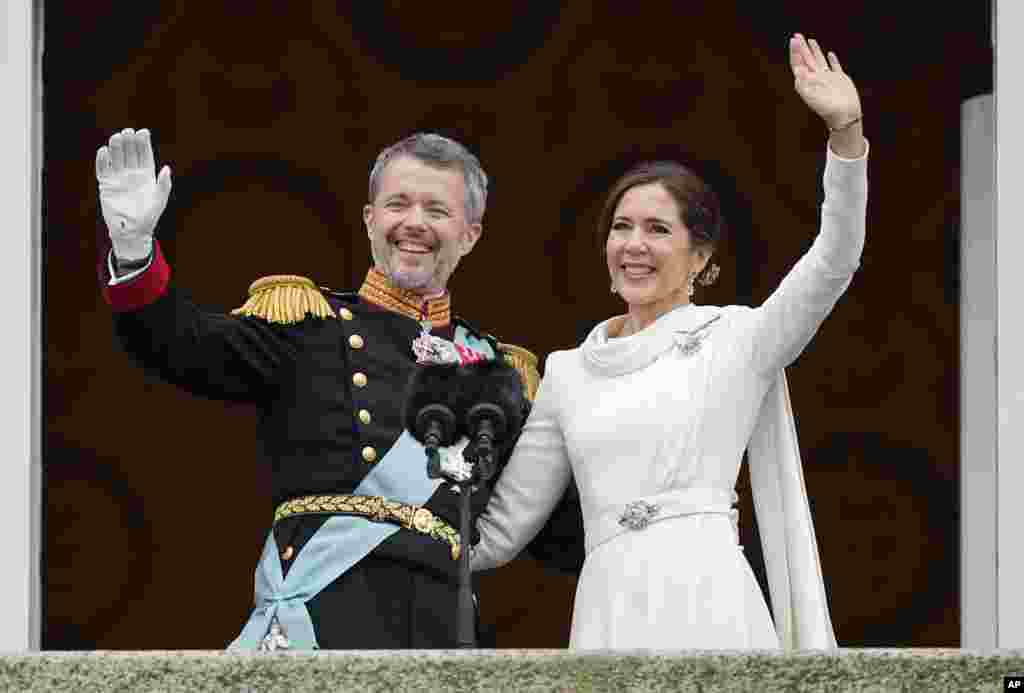 Denmark&#39;s King Frederik X and Denmark&#39;s Queen Mary wave from the balcony of Christiansborg Palace in Copenhagen.&nbsp;Queen Margrethe II has become Denmark&#39;s first monarch to abdicate in nearly 900 years when she handed over the throne to her son, who has become King Frederik X.&nbsp;