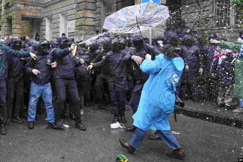 Police disperse demonstrators trying to block the Parliament building during an opposition protest against &quot;the Russian law&quot; in the center of Tbilisi, Georgia.&nbsp;Daily protests are continuing against a proposed bill that critics say would stifle media freedom and obstruct the country&#39;s bid to join the European Union.