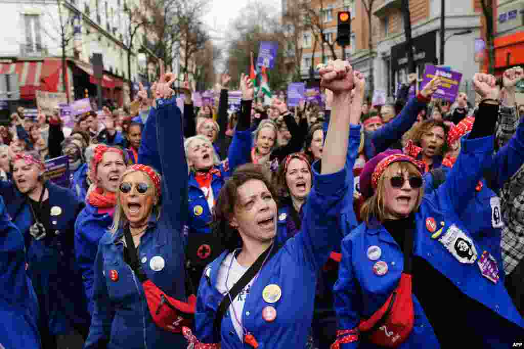 Members of the feminist collective "Les Rosies" participate to a march as part of the International Women's Rights Day, in Paris. 