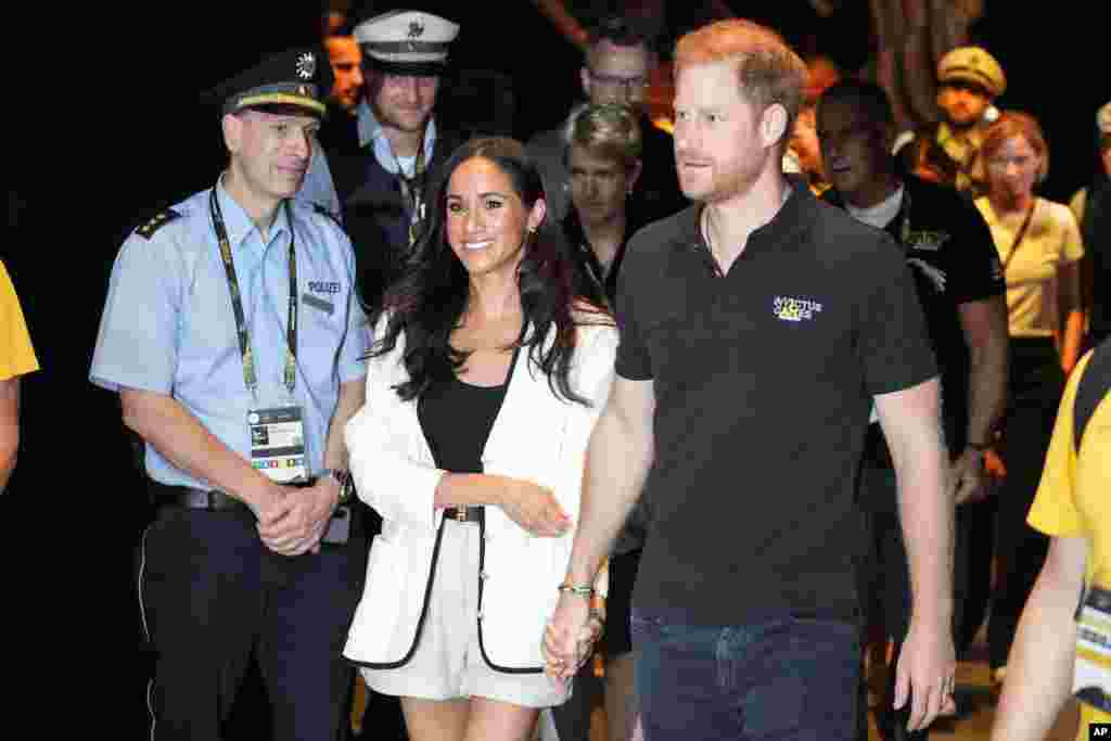 Britain&#39;s Prince Harry, right, and Meghan, Duchess of Sussex, arrive to a wheelchair basketball match at the Invictus Games in Duesseldorf, Germany.