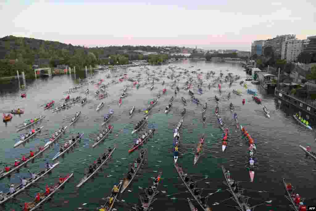 Rowers participate in the annual &#39;La Traversee de Paris en Aviron&#39; rowing event in the River Seine in Paris, France. The event brings together more than 1,000 rowers and 230 boats.