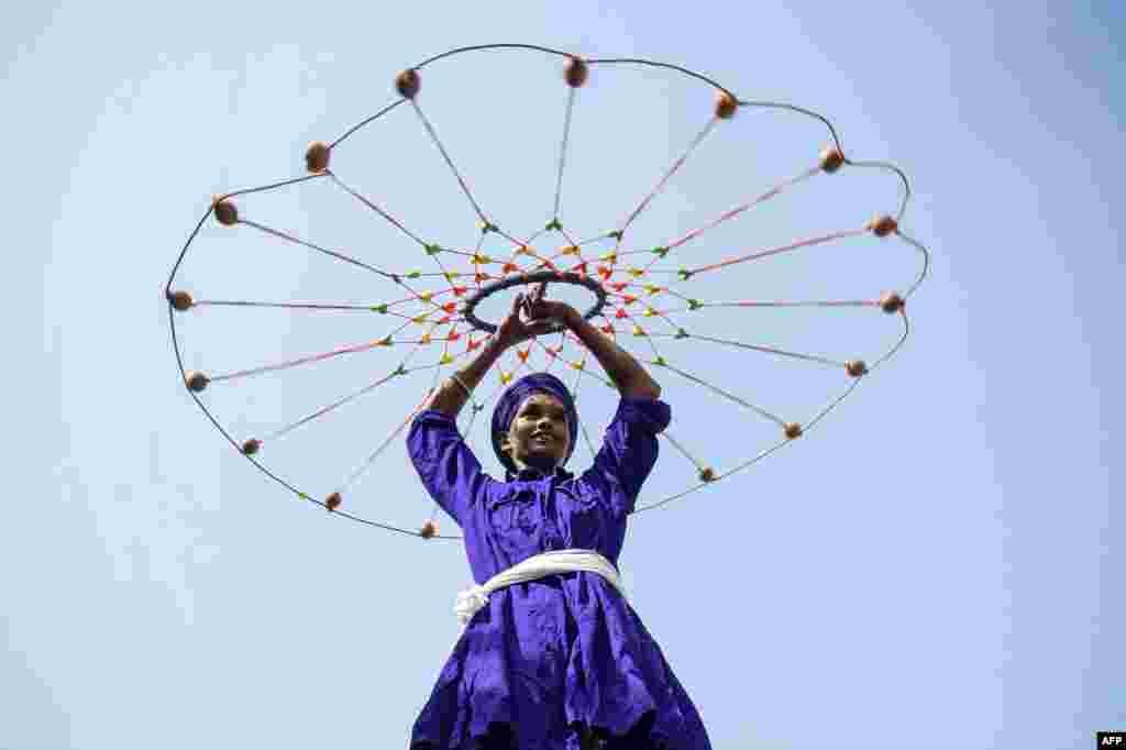 A young man performs &#39;Gatka&#39;, an ancient form of the Sikh martial art, during a Sikh religious procession to mark the birth anniversary of Shaheed Baba Jiwan Singh in Amritsar, India.