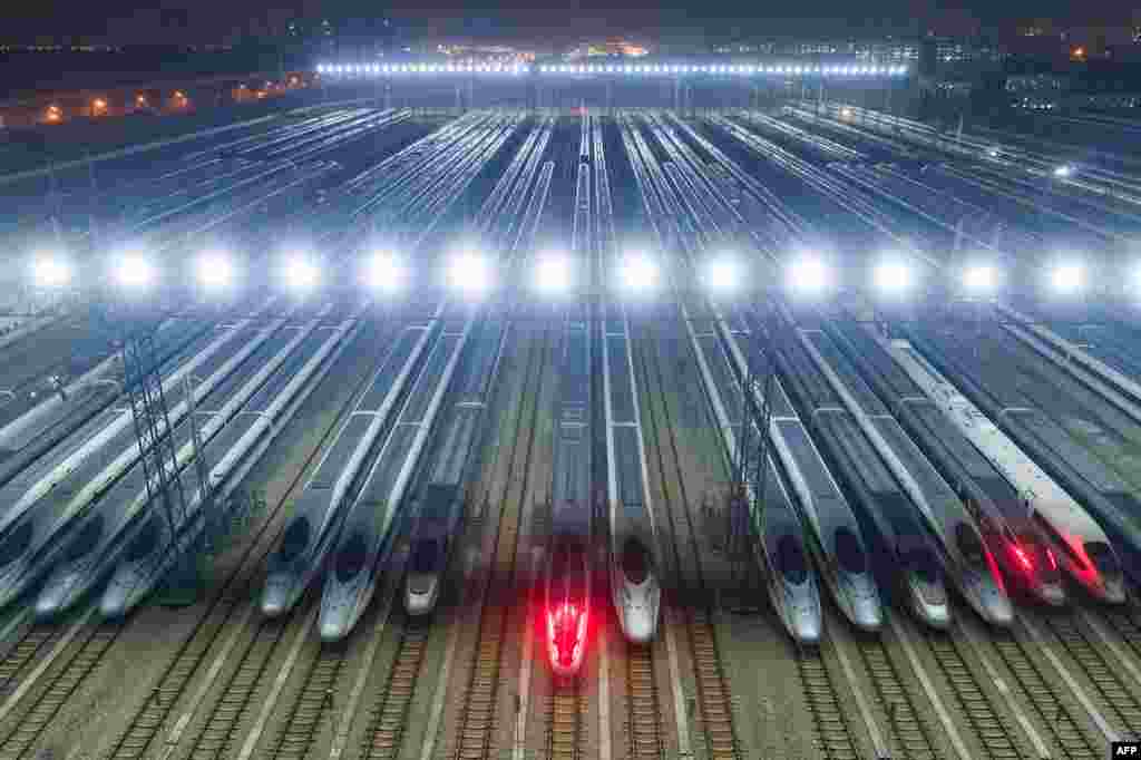 High-speed trains are lined up after undergoing maintenance in preparation for the annual Lunar New Year travel peak, at a maintenance base in Wuhan, in Chinas central Hubei province.