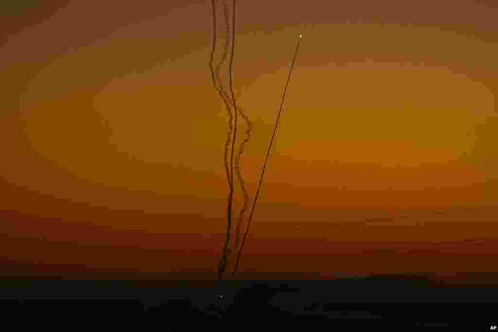 Rockets are fired toward Israel from the Gaza Strip, as seen from southern Israel.