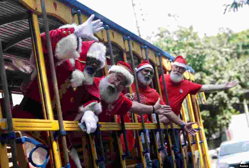 Brazil&#39;s Santa Claus school members travel on a Bonde (tram) as they take part in their graduation, ahead of the Christmas season in Rio de Janeiro, Brazil.