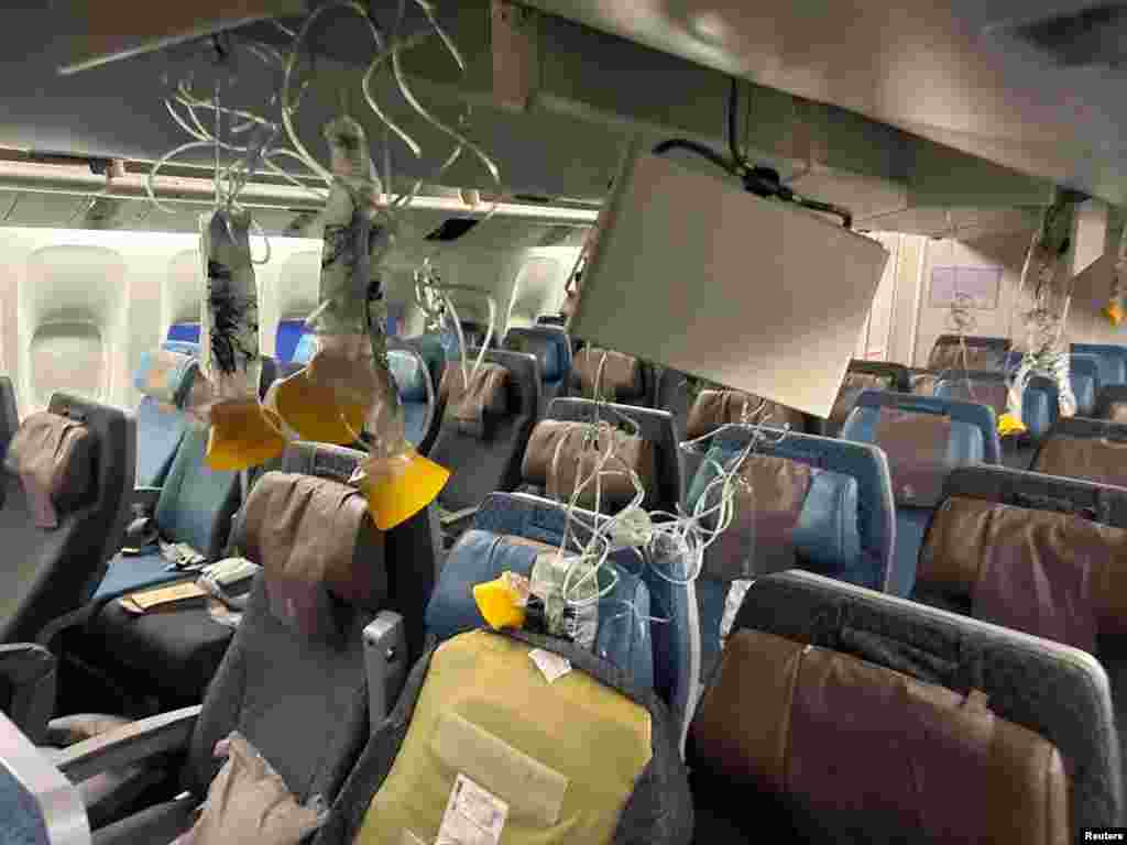 The interior of Singapore Airline flight SQ321 is pictured after an emergency landing at Bangkok&#39;s Suvarnabhumi International Airport, Thailand.&nbsp;One passenger&nbsp;died of a suspected heart attack and&nbsp;30 injured after the flight hit severe turbulence, flinging passengers and crew around the cabin and forcing the plane to land in Bangkok, officials and the airline said.