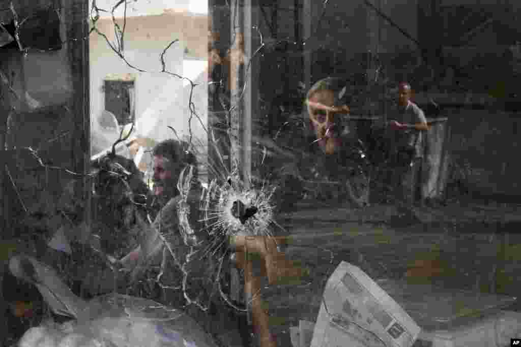 A bullet hole is seen in a shop window following an Israeli military raid in the Jenin refugee camp, West Bank.&nbsp;Palestinian health officials say the death toll over a day of fighting between Israel and the Palestinians in the occupied West Bank and the Gaza Strip has risen to six, four from Jenin.&nbsp;