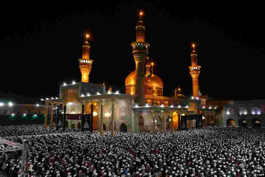 Muslim worshippers perform prayer rituals on Laylat al-Qadr (Night of Destiny), one of the holiest nights during the holy month of Ramadan, at the shrine of Imam Musa al-Kadhim in Baghdad&#39;s Kadhimiya neighborhood, Iraq.