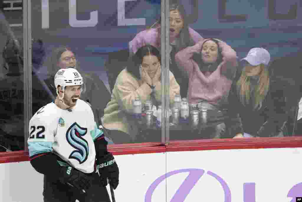 Seattle Kraken right wing Oliver Bjorkstrand celebrates after scoring the go-ahead goal against the Colorado Avalanche as fans react during the third period of an NHL hockey game, Nov. 9, 2023, in Denver. 