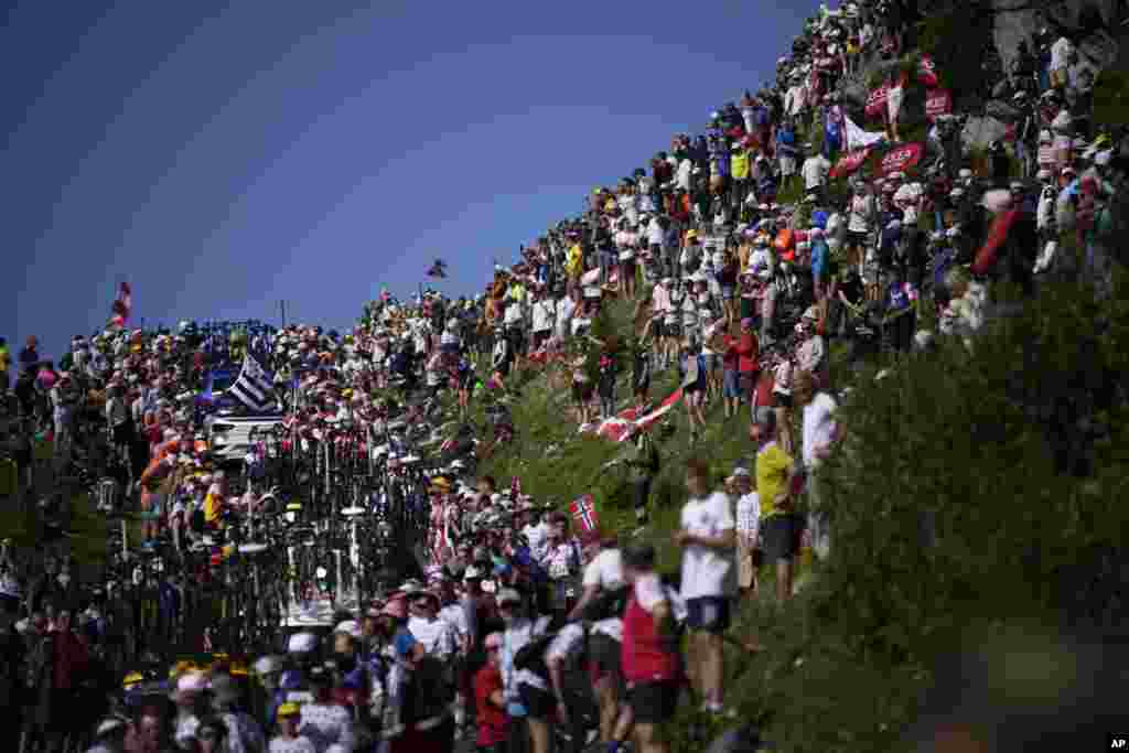 Team cars and motorcycles got stuck in the crowd on the Col de la Loze pass during the seventeenth stage of the Tour de France cycling race over 166 kilometers (103 miles) with start in Saint-Gervais Mont-Blanc and finish in Courchevel, France.&nbsp;
