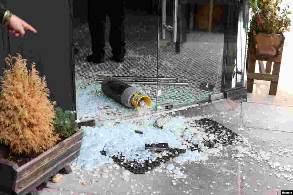 A vandalized Kosher restaurant is seen near a bridge with &#39;Free Palestine&#39; painted on it, in Golders Green in London.