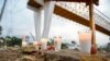 Votive candles are pictured at the site of a truck accident in Tuxtla Gutierrez