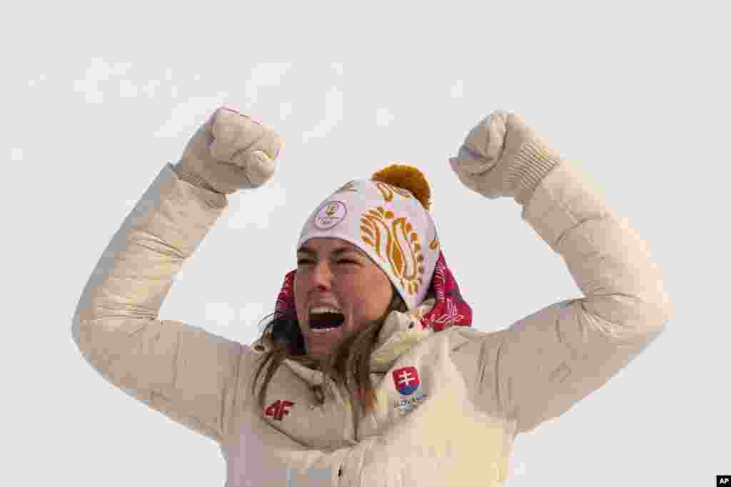 Petra Vlhova of Slovakia celebrates during the medal ceremony after winning the gold medal in the women&#39;s slalom at the 2022 Winter Olympics in the Yanqing district of Beijing.