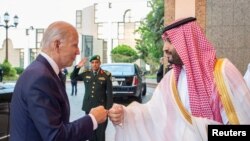 Saudi Crown Prince Mohammed bin Salman fist bumps U.S. President Joe Biden upon his arrival at Al Salman Palace, in Jeddah