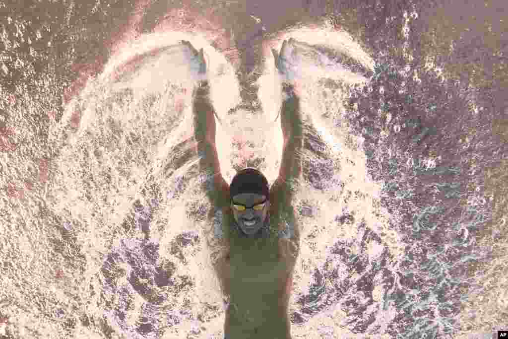 Al Kulaibi Mskm of Oman competes in the men&#39;s 100-meter butterfly heat at the World Aquatics Championships in Doha, Qatar.