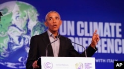 Former US President Barack Obama gestures as he speaks during the COP26 U.N. Climate Summit in Glasgow, Scotland, Nov. 8, 2021,
