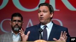 FILE - Florida Gov. Ron DeSantis speaks at the Doral Academy Preparatory School in Doral, Fla., Sept. 14, 2021.