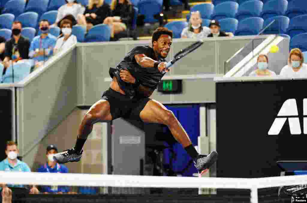 Gael Monfils of France hits a return during his second round match against Kazakhstan&#39;s Alexander Bublik on day three of the Australian Open tennis tournament in Melbourne.