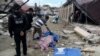 Las fotos confirmadas por las autoridades mostraron cuerpos alineados a lo largo de la calle el sábado, algunos en bolsas y otros con la cara cubierta con ropa.