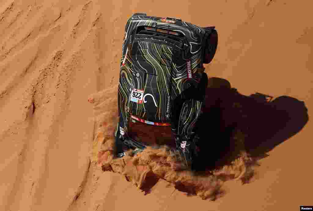 GCK Motorsport&#39;s Guerlain Chicherit and co-driver Alex Winocq crash during stage 4 of the annual Dakar Rally, from Al Qaysumah to Riyadh, Saudi Arabia. 