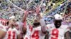 Ohio State wide receiver K.J. Hill (14) holds the trophy following the team's 34-21 win over Wisconsin in the Big Ten championship NCAA college football game, Dec. 8, 2019, in Indianapolis.