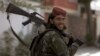A Taliban fighter patrols in Wazir Akbar Khan in the city of Kabul, Afghanistan, Wednesday, Aug. 18, 2021. 