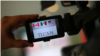 Las banderas de los países del TLCAN en el visor de una cámara.