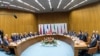 FILE - Participants of the Iran nuclear talks that culminated in the signing of the Joint Comprehensive Plan of Action (JCPOA), are pictured during a meeting at the United Nations building in Vienna, Austria, July 14, 2015.