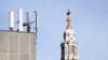 FILE - In this Tuesday, Jan 28, 2020 file photo, mobile network phone masts are visible in front of St Paul's Cathedral in the City of London. Dozens of European cell towers have been destroyed in recent arson attacks that officials and wireless…